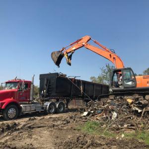 Land Clearing Tractor & Dumpster