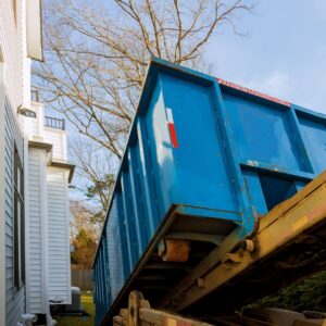 Dumpster being place at a residence